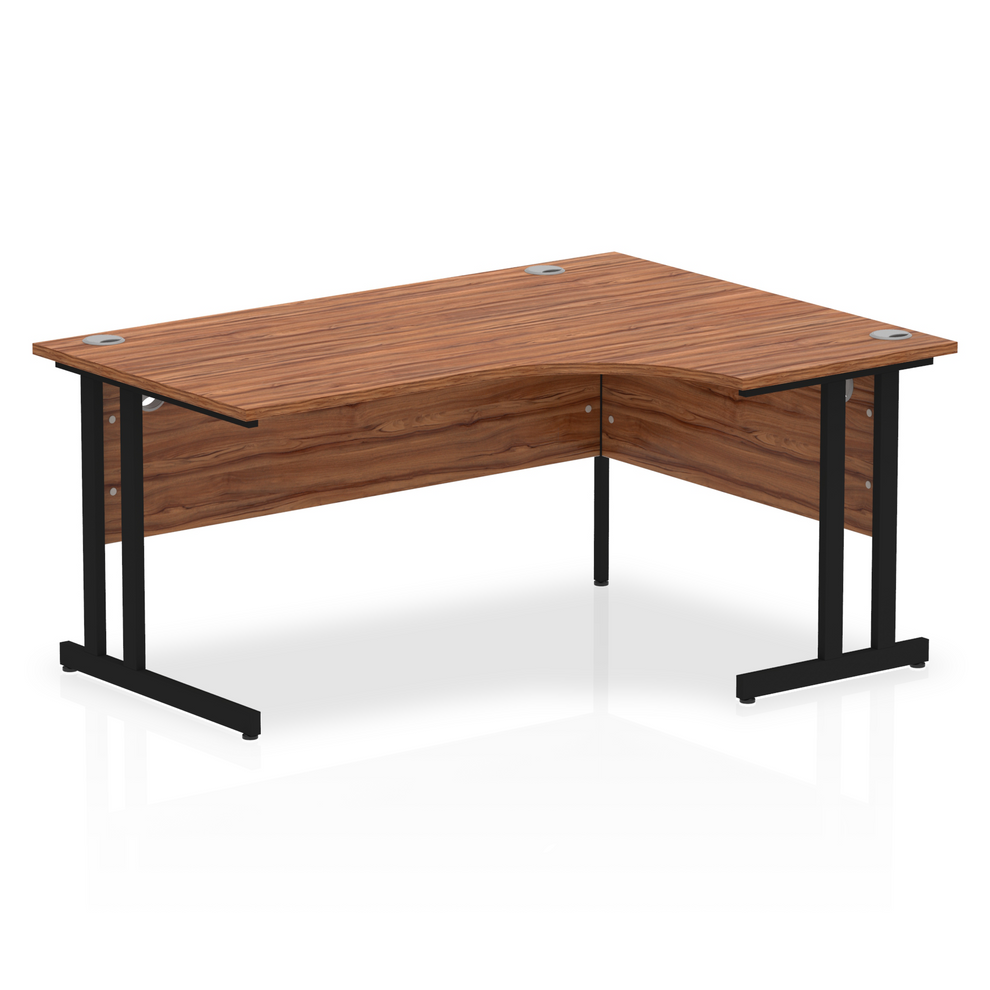 Walnut L-shaped desk with drawers on a white background