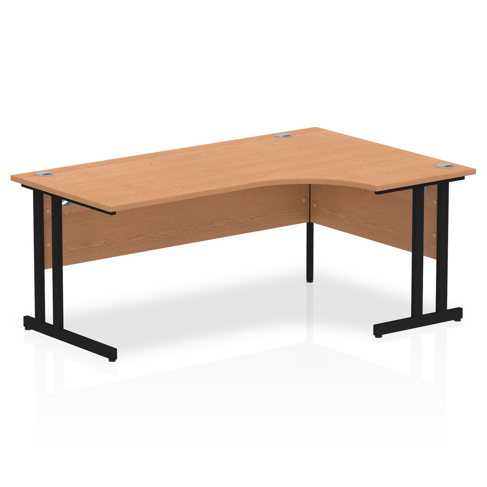 Oak L-shaped desk with drawers on a white background