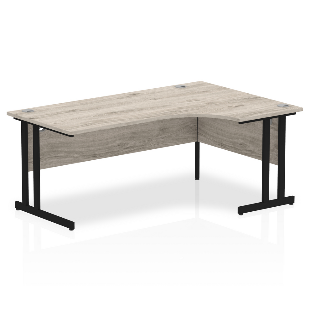 Grey oak L-shaped desk with drawers on a white background