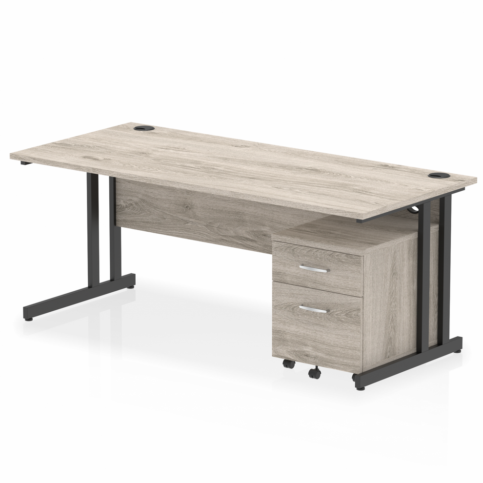 Grey oak straight desk with drawers on a white background