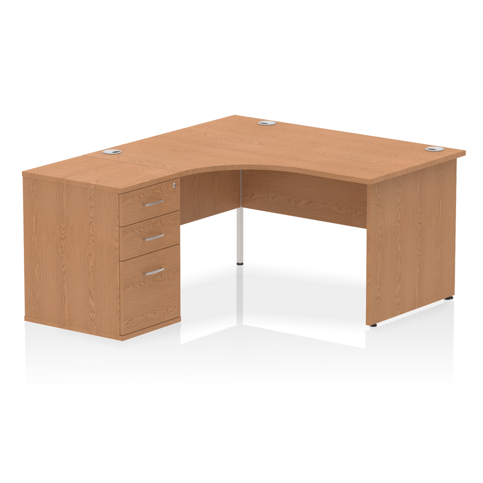 Oak L-shaped desk with drawers on a white background