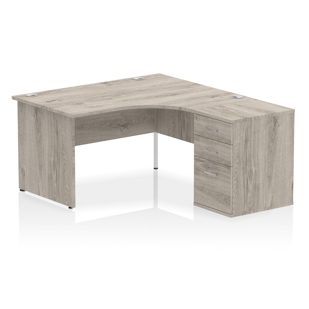 Grey oak L-shaped desk with drawers on a white background