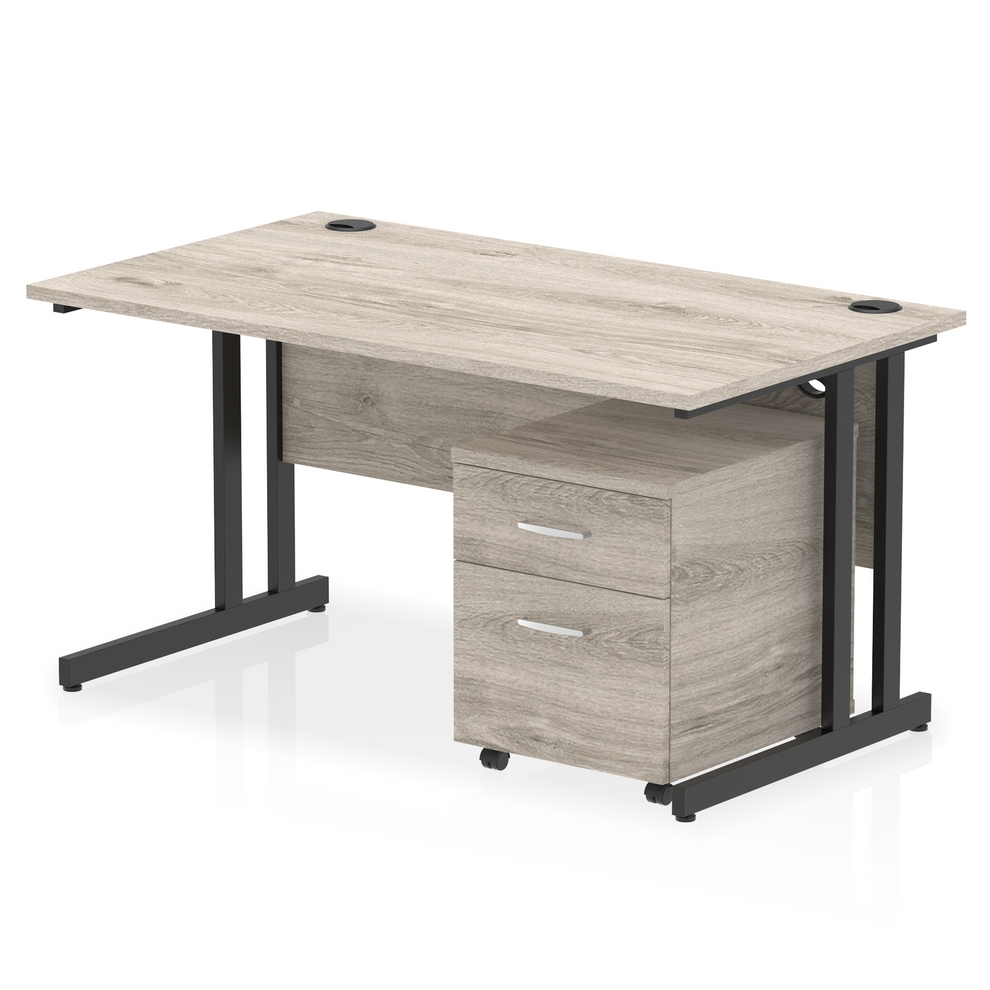 Grey oak straight desk with drawers on a white background