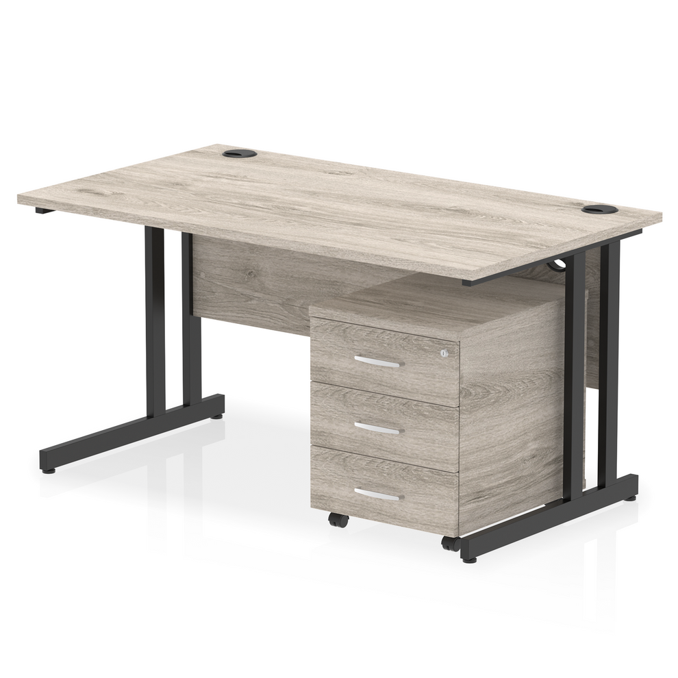 Grey oak straight desk with drawers on a white background