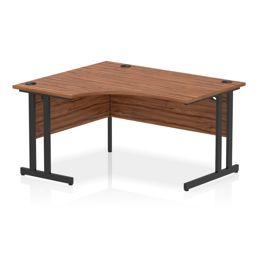 Walnut L-shaped desk with drawers on a white background