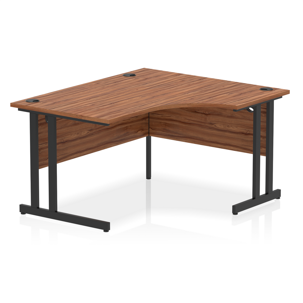 Walnut L-shaped desk with drawers on a white background