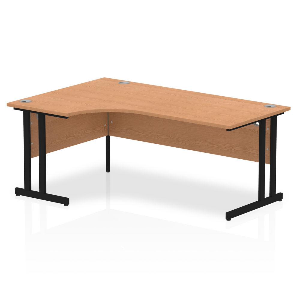 Oak L-shaped desk with drawers on a white background