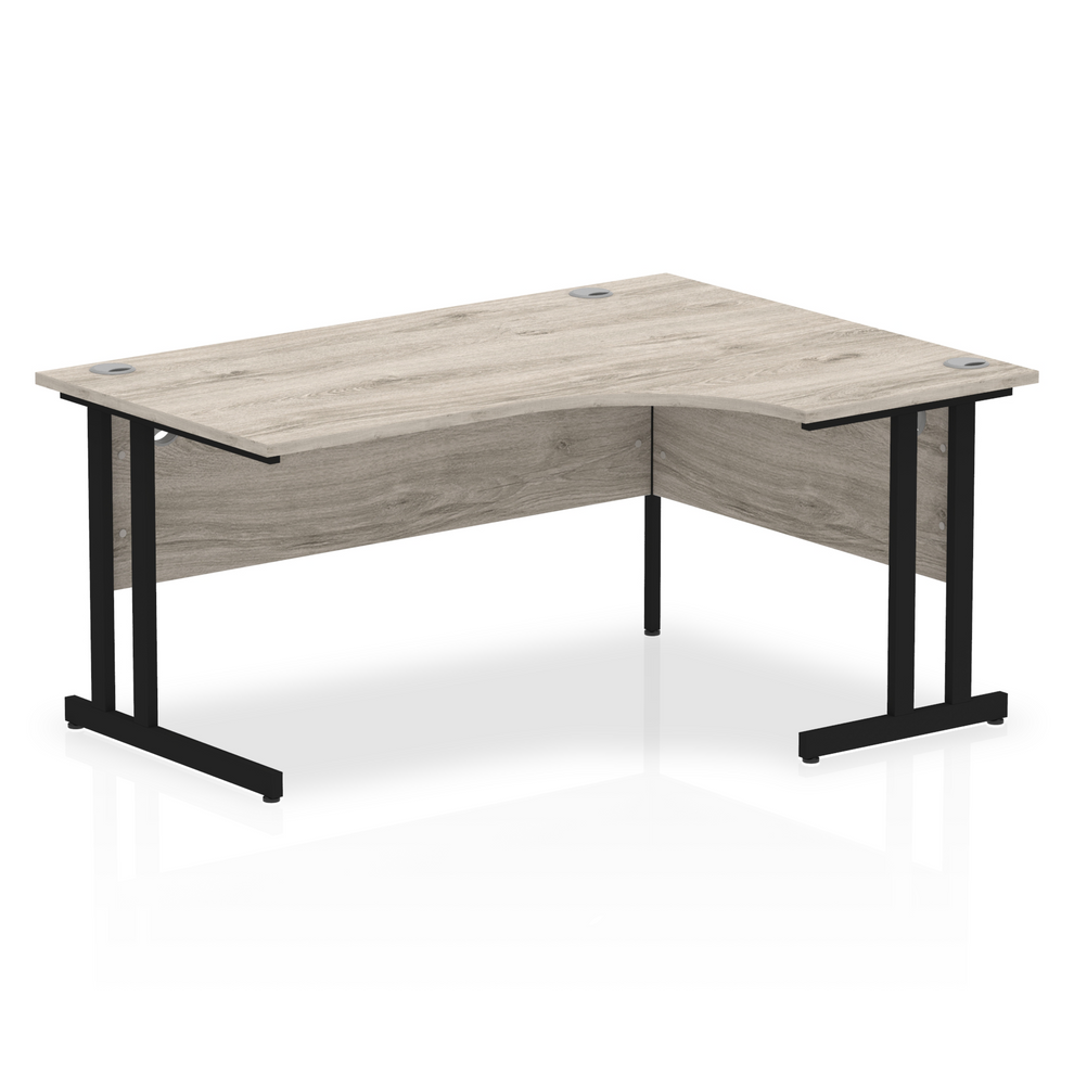 Grey oak L-shaped desk with drawers on a white background