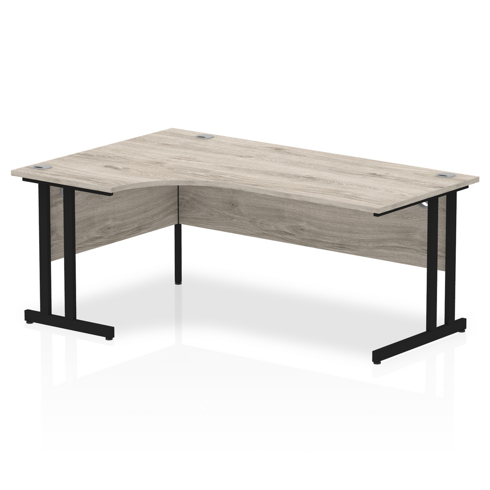 Grey oak L-shaped desk with drawers on a white background