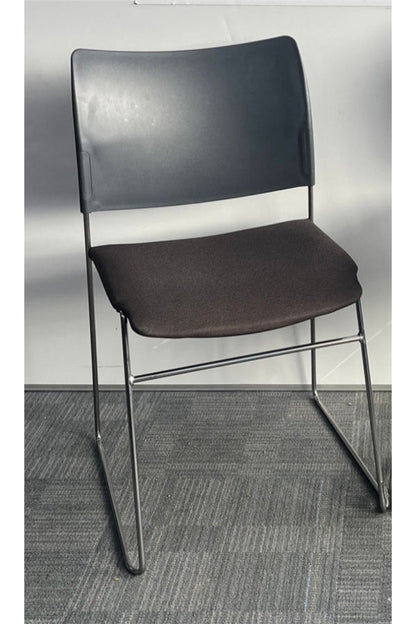 Gray chair with a metal frame on a gray floor and background