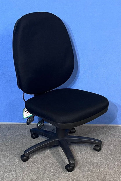 Black office chair against a blue wall