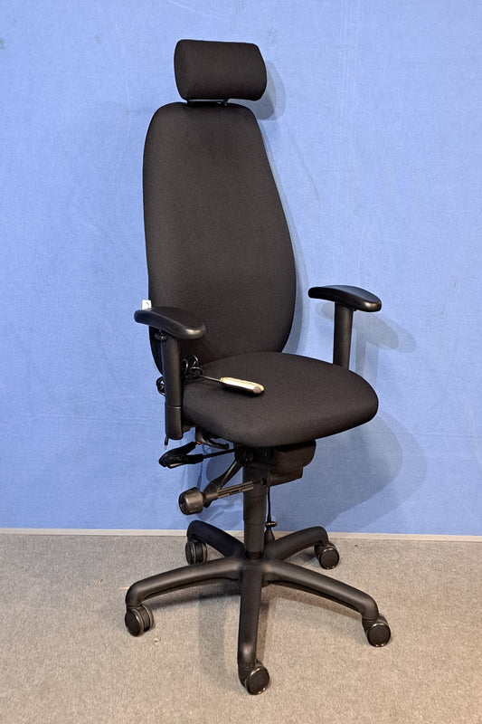 Black office chair on a blue and grey floor
