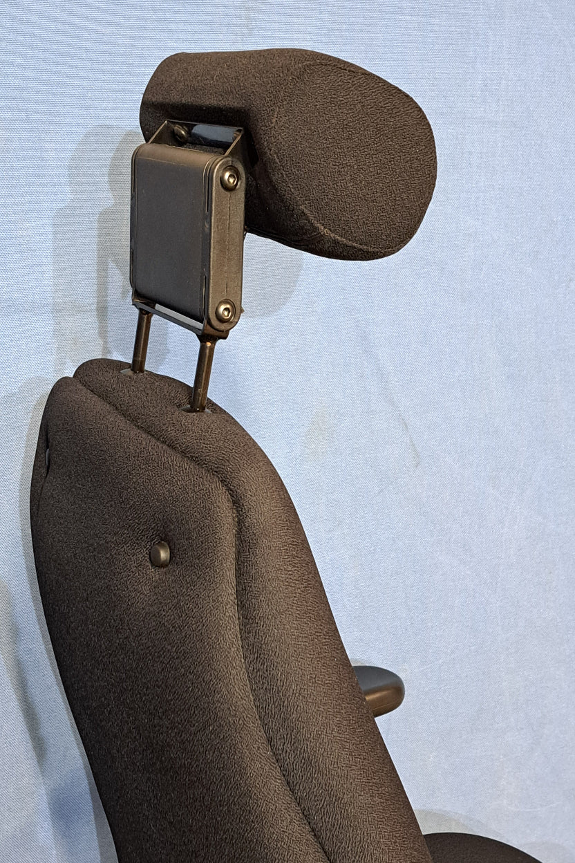 Black headrest on a light blue background