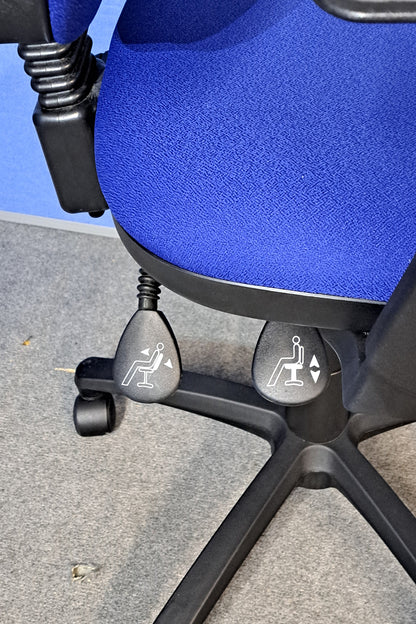 Blue office chair on a blue background and grey floor.