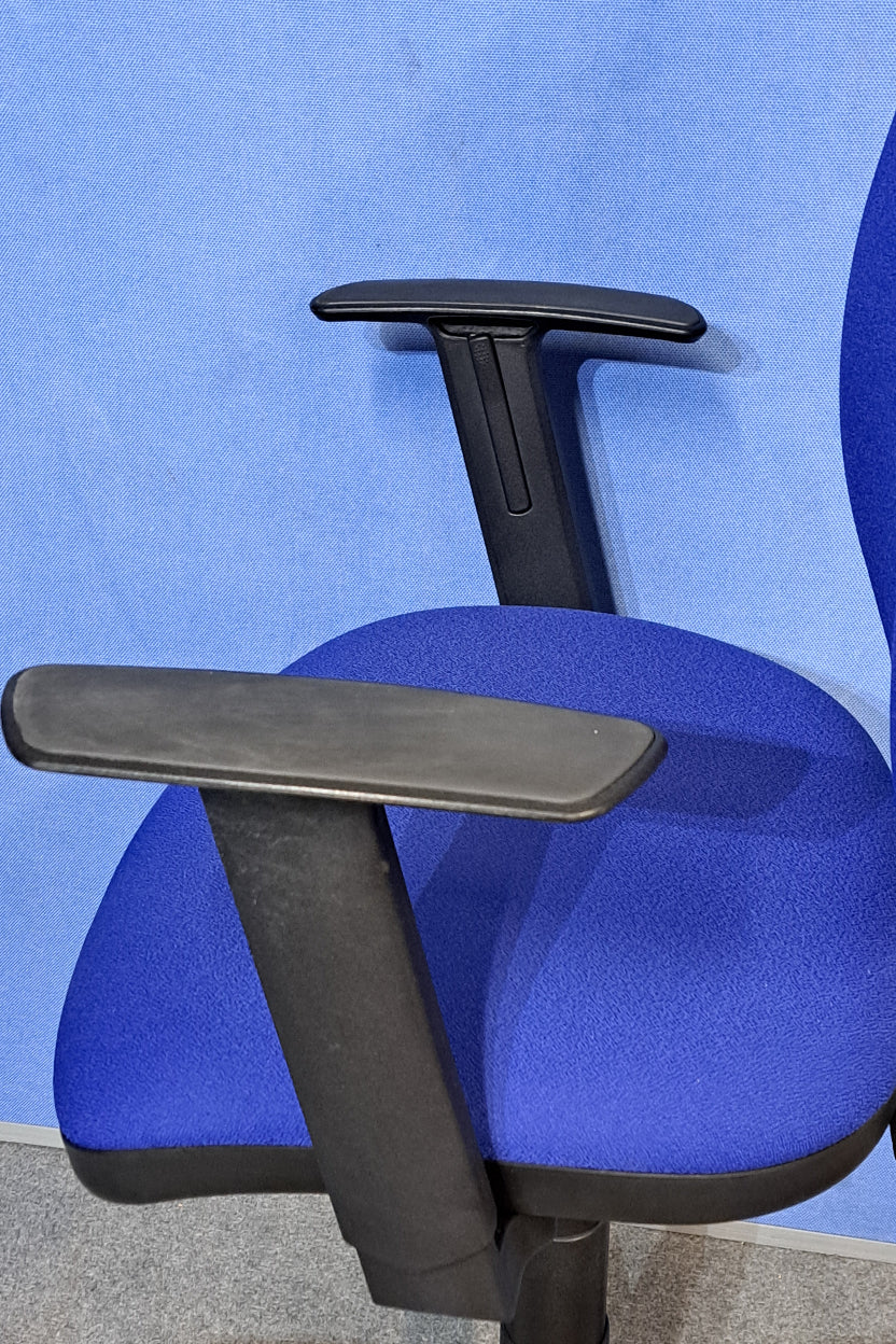 Blue office chair on a blue background and grey floor.