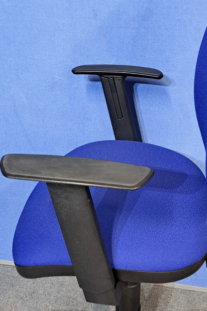 Blue office chair on a blue background and grey floor.