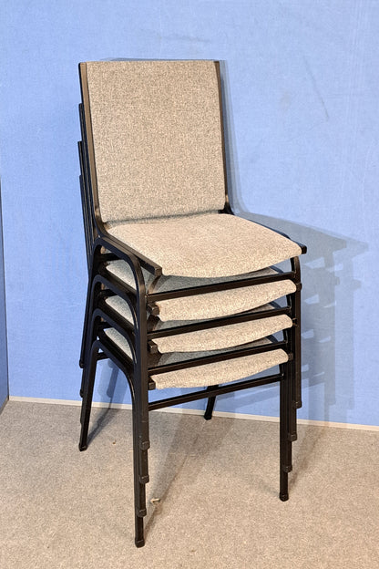Four grey meeting chairs on a blue background and grey floor