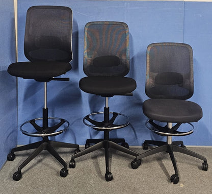 Draughtsman chair on blue wall and grey carpet