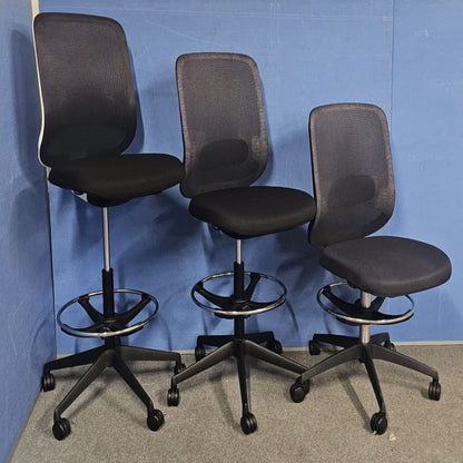 Draughtsman chair on blue wall and grey carpet