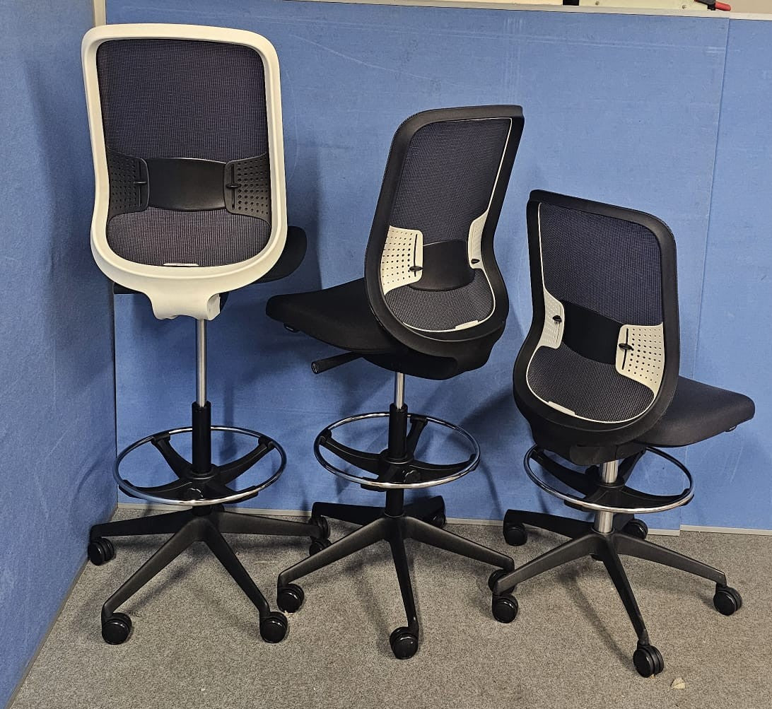 Draughtsman chair on blue wall and grey carpet