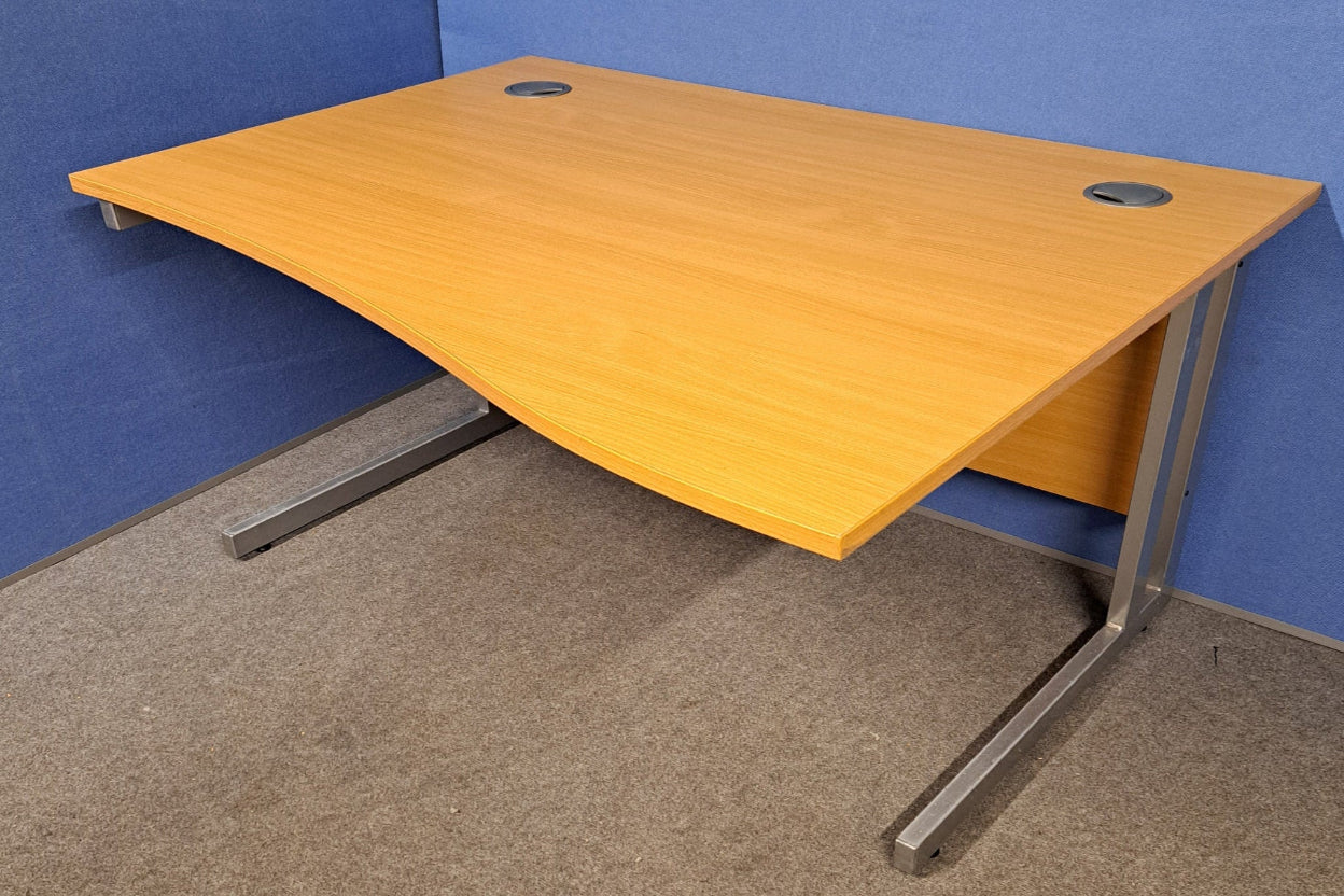 Wooden desk with metal legs on a blue and gray floor