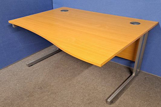 Wooden desk with metal legs on a blue and gray floor