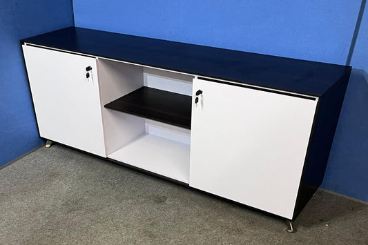 Black and white storage cabinet against a blue wall