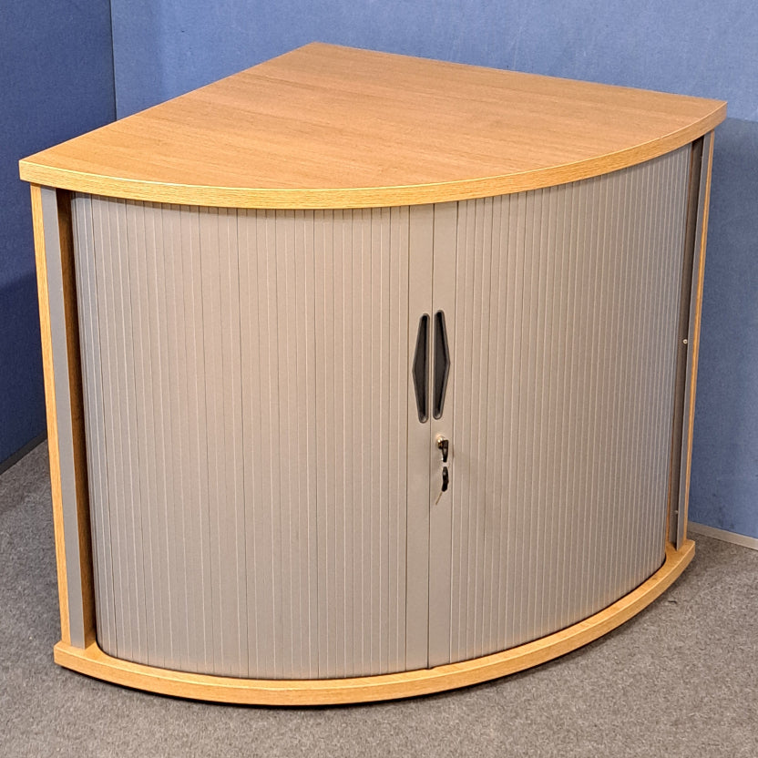 Tambour cupboard on a blue wall and grey carpet