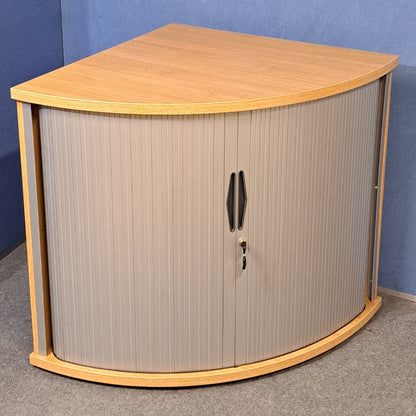 Tambour cupboard on a blue wall and grey carpet
