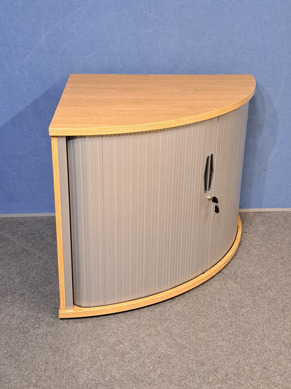Tambour cupboard on a blue wall and grey carpet
