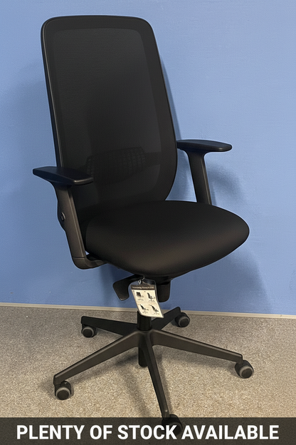 Black office chair on a blue wall background