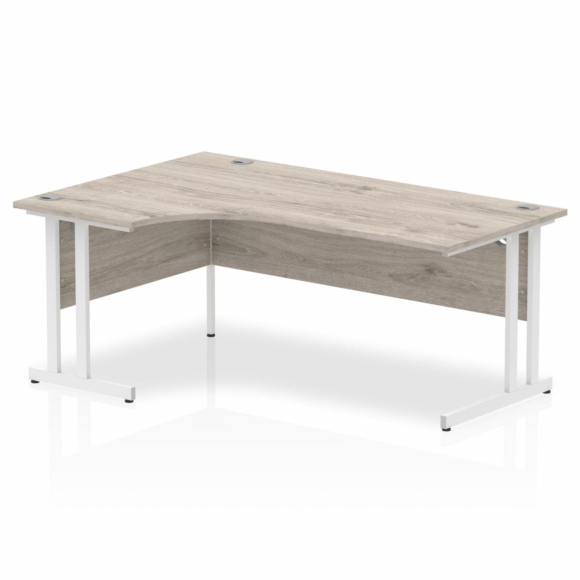 Grey oak L-shaped desk with drawers on a white background