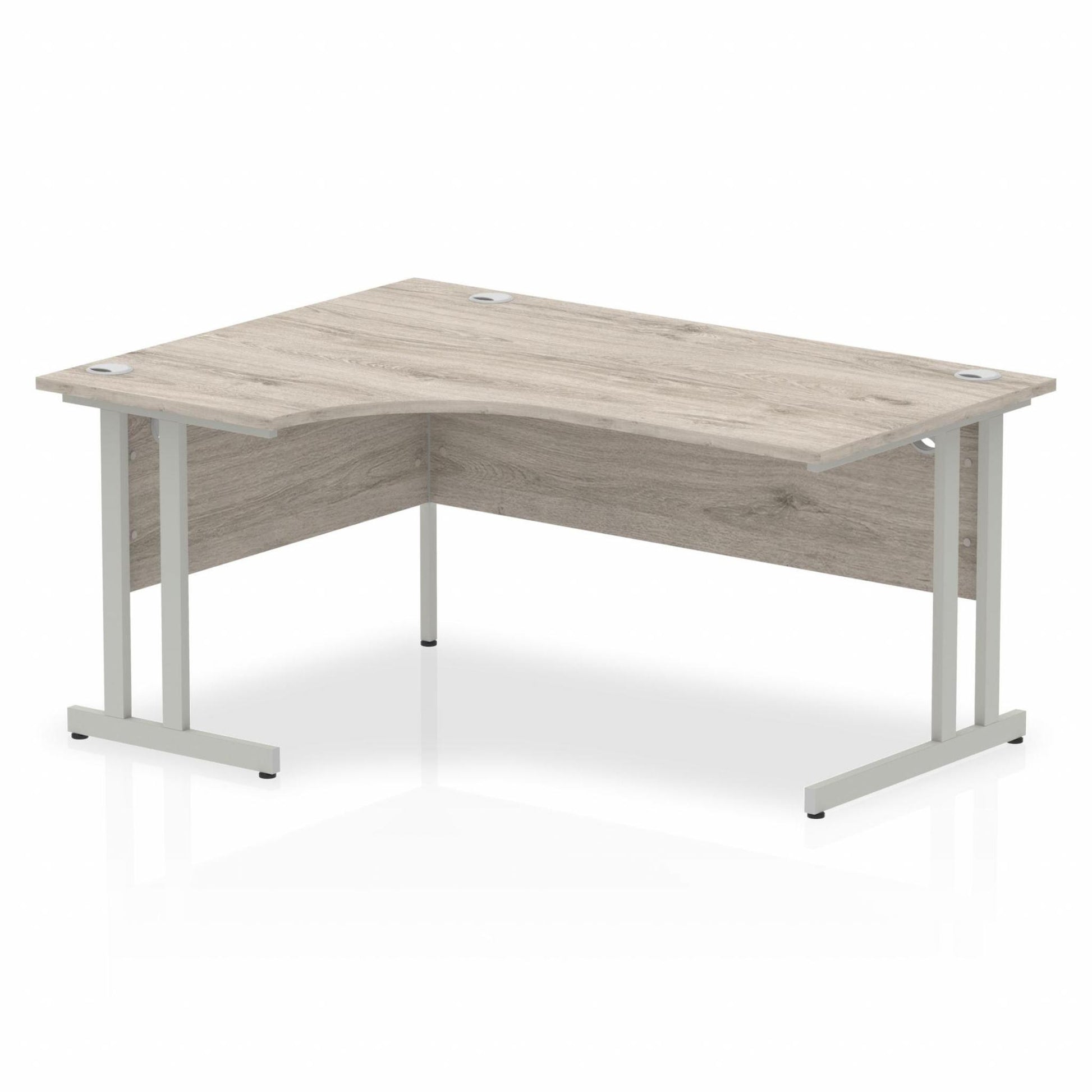 Grey oak L-shaped desk with drawers on a white background
