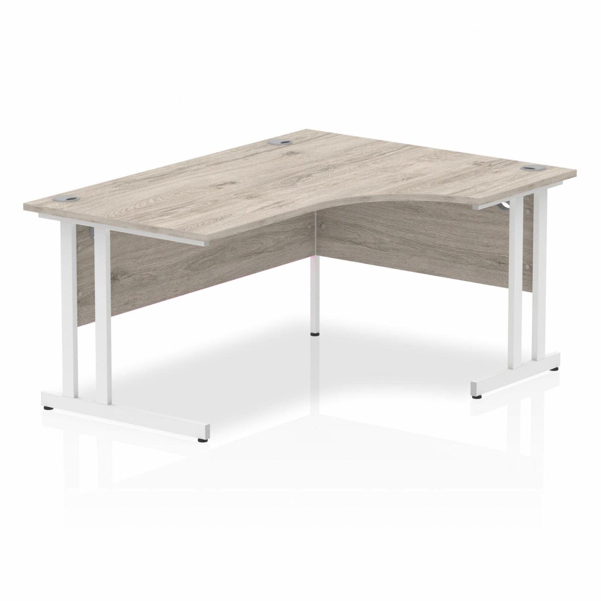 Grey oak L-shaped desk with drawers on a white background